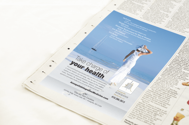 A newspaper advertisement with a woman in a white dress.