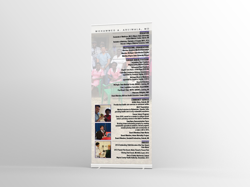 A roll up banner with pictures of people and text.