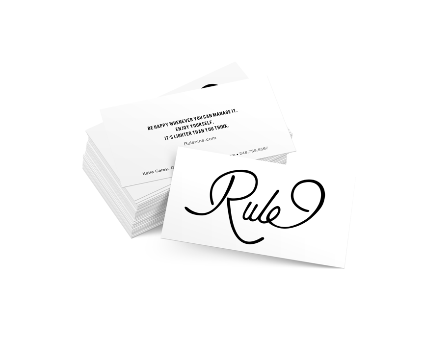 A stack of business cards with the word 