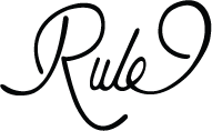 A black and white image of the word rule.